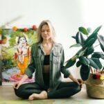 Woman Sitting on the Floor While Meditating